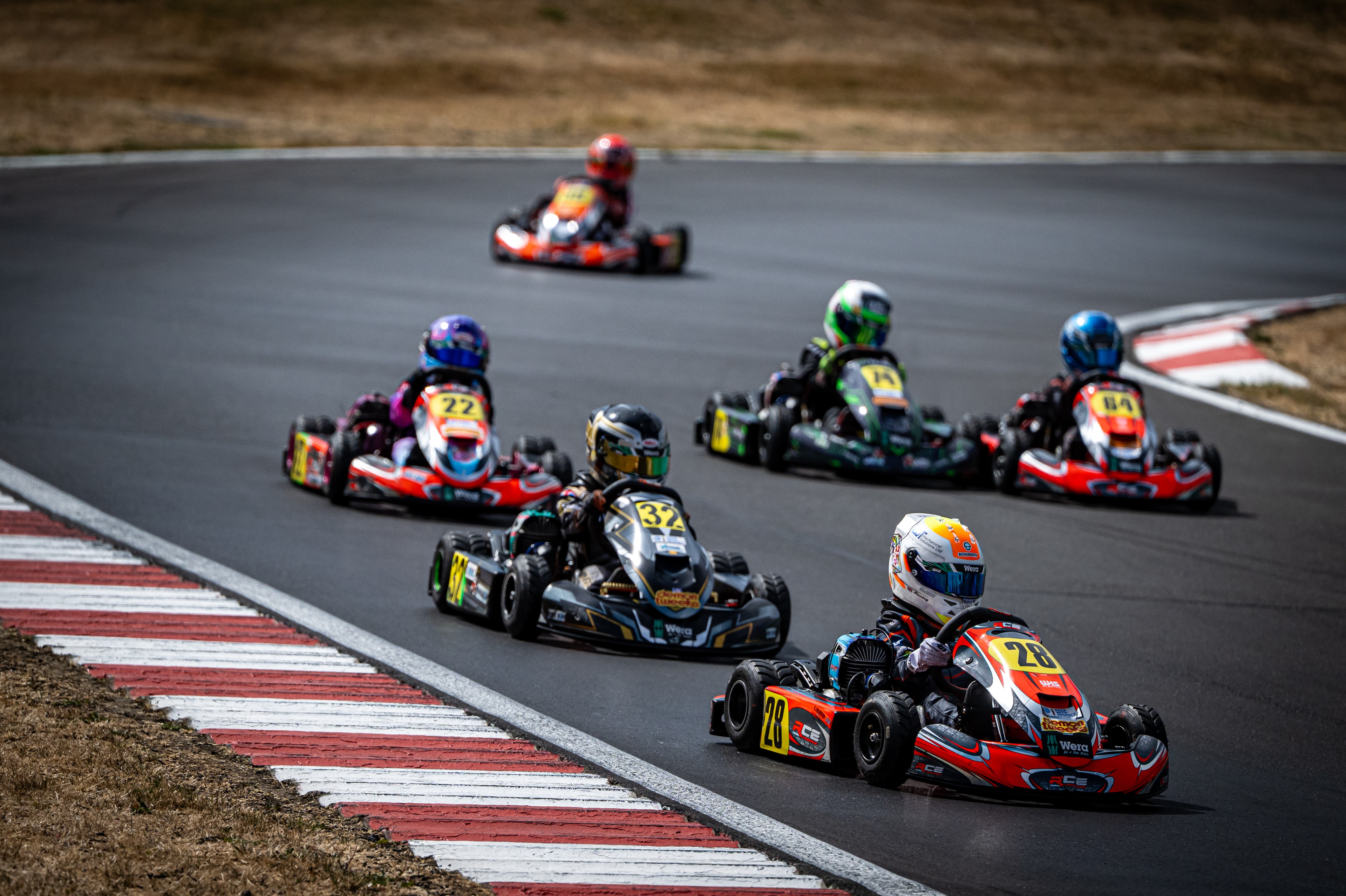 Henry Exton kart number 32 in pack battle at PFI