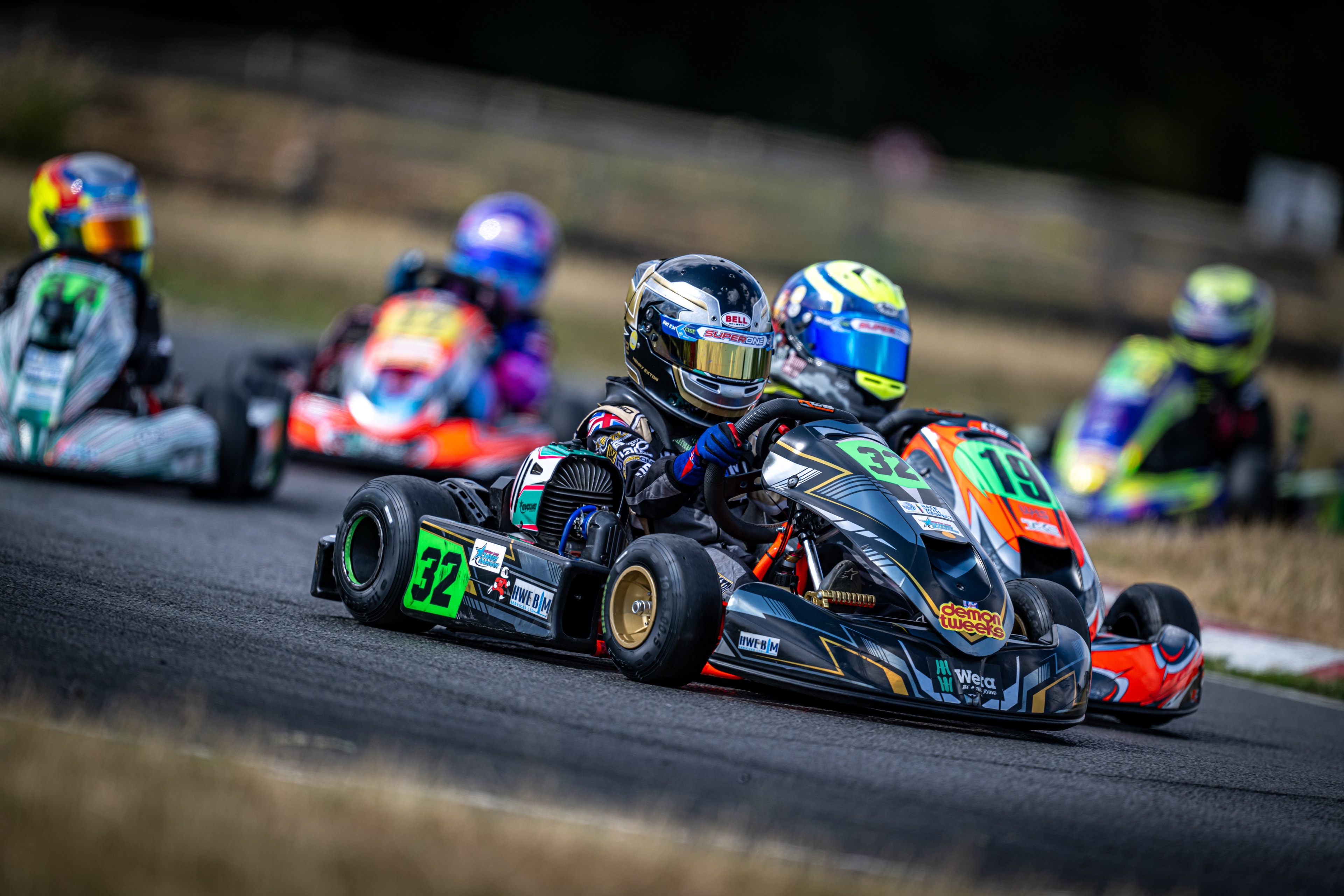 Henry Exton kart number 32 leading pack in race at Whilton Mill